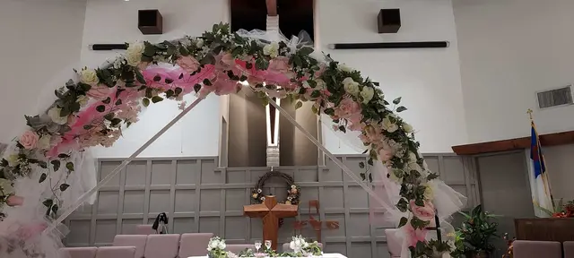 Pink floral arch for a church celebration