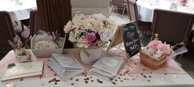 Blush pink reception table with florals